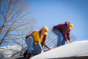 Virginia Baptist Disaster Response volunteers tarp a roof in Appomattox following the February tornadoes